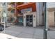 Entrance to Jack Kerouac Lofts building, with dark double doors and a sign above the doorway at 3100 Huron St # 2D, Denver, CO 80202