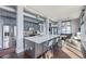 A modern kitchen with stainless steel appliances, butcher block countertops, and gray cabinets with an island at 3100 Huron St # 2D, Denver, CO 80202