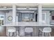 Spacious kitchen with a large island, seating, and sleek stainless steel appliances at 3100 Huron St # 2D, Denver, CO 80202