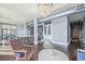 Open-concept living area connecting kitchen, dining, and living spaces with hardwood floors at 3100 Huron St # 2D, Denver, CO 80202