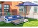 Relaxing outdoor patio area with comfortable seating and stylish furnishings, perfect for entertaining at 3100 Huron St # 2D, Denver, CO 80202