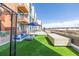 Expansive outdoor patio area with multiple seating arrangements, ideal for gatherings and relaxation at 3100 Huron St # 2D, Denver, CO 80202