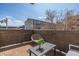 Secluded outdoor patio featuring a cozy seating area with a chair and table, perfect for relaxing at 3100 Huron St # 2D, Denver, CO 80202