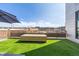 Inviting outdoor patio space with modern furnishings, offering a cozy and private retreat at 3100 Huron St # 2D, Denver, CO 80202