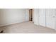 Spacious bedroom featuring plush carpet and double-door closet, offering comfort and ample storage at 14390 Heritage Dr, Mead, CO 80504