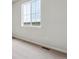 Bright room with large window, neutral walls, and plush carpeting, ready for personalization at 14390 Heritage Dr, Mead, CO 80504