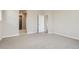 Comfortable bedroom with neutral tones, carpeting, and ample space at 14390 Heritage Dr, Mead, CO 80504