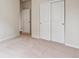 Bright room featuring soft carpet and closet with double doors, ready for comfortable living at 14390 Heritage Dr, Mead, CO 80504