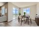 Bright dining room with wood table, slider to deck, and neutral walls and trim at 14390 Heritage Dr, Mead, CO 80504