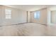 Bright and spacious room featuring large windows and light wood floors, perfect for versatile use at 14390 Heritage Dr, Mead, CO 80504