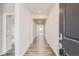 Clean entryway with light colored walls and wood flooring creates an inviting atmosphere at 14390 Heritage Dr, Mead, CO 80504