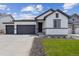 Beautiful single Gathering home featuring a 2 car garage and manicured front lawn at 14390 Heritage Dr, Mead, CO 80504