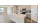 Contemporary kitchen showcasing quartz countertops, stainless appliances, and gray cabinets at 14390 Heritage Dr, Mead, CO 80504