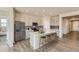 Spacious kitchen with stainless steel appliances, a large center island, and modern cabinetry at 14390 Heritage Dr, Mead, CO 80504