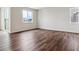 Open living room area with large windows and sliding glass door allowing plenty of natural light at 14390 Heritage Dr, Mead, CO 80504