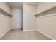A well-lit walk-in closet with carpeted flooring and metal clothing racks for ample storage at 14390 Heritage Dr, Mead, CO 80504