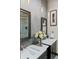 Modern bathroom featuring double sinks, sleek fixtures, and a glass-enclosed shower at 1290 S Lininger Dr, Golden, CO 80401