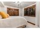 Bedroom with accent wall and window with view of outdoor staircase at 1290 S Lininger Dr, Golden, CO 80401