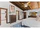 A cozy bedroom with hardwood trim and an ensuite bathroom and walk in closet at 1290 S Lininger Dr, Golden, CO 80401