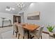 Elegant dining room features a modern light fixture, wooden table, and comfortable seating at 1290 S Lininger Dr, Golden, CO 80401