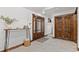 Entryway features wooden accents, tile flooring, and a decorative table at 1290 S Lininger Dr, Golden, CO 80401