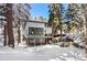 Back exterior of a modern mountain home featuring a hot tub and large balcony at 1290 S Lininger Dr, Golden, CO 80401