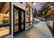 Outdoor deck offers scenic views of a wooded landscape with large windows letting in plenty of natural light at 1290 S Lininger Dr, Golden, CO 80401