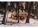 Desirable home surrounded by snow-covered mountains, mature trees, and an outdoor balcony at 1290 S Lininger Dr, Golden, CO 80401