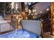 Exterior view showcasing the hot tub area with string lights and access to the home's upper and lower levels at 1290 S Lininger Dr, Golden, CO 80401