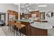 Open kitchen featuring an island with counter seating, stainless steel appliances, and modern cabinetry at 1290 S Lininger Dr, Golden, CO 80401