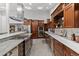 Well-equipped kitchen featuring stainless steel appliances, granite countertops, and custom cabinetry at 1290 S Lininger Dr, Golden, CO 80401