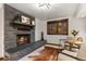 Inviting living room featuring a stone fireplace and a cozy seating area at 1290 S Lininger Dr, Golden, CO 80401