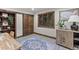 Bright office featuring barn door, wood trim, and area rug at 1290 S Lininger Dr, Golden, CO 80401