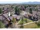 Aerial view of property showing exterior facade, roof, landscaping and nearby parking at 6251 Willow Ln, Boulder, CO 80301