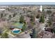 Community aerial view showcasing landscaping, tennis court, pool, and surrounding homes at 6251 Willow Ln, Boulder, CO 80301