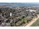 Aerial view showing community, nearby commercial area, lake and mountain views at 6251 Willow Ln, Boulder, CO 80301