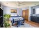 Comfortable bedroom features hardwood floors, ample natural light, ceiling fan, and closet storage at 6251 Willow Ln, Boulder, CO 80301