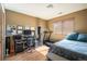 Bedroom with natural light showcases a functional workspace and comfortable resting area at 6251 Willow Ln, Boulder, CO 80301