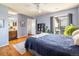 Bedroom features hardwood floors, ensuite bath, ceiling fan and access to a balcony at 6251 Willow Ln, Boulder, CO 80301