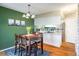 Dining area featuring a wooden table, chairs, and a view into the kitchen at 6251 Willow Ln, Boulder, CO 80301