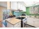 Bright kitchen featuring granite countertops and stainless steel appliances at 6251 Willow Ln, Boulder, CO 80301
