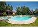 Community pool with mature landscaping, hot tub, and plentiful seating at 6251 Willow Ln, Boulder, CO 80301