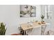 Dining room with modern table and chairs, and a contemporary art piece on the wall at 5128 W 26Th Ave # 207, Denver, CO 80212