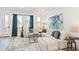 Bright living room features a sectional sofa, modern decor, and natural light from large windows at 5128 W 26Th Ave # 207, Denver, CO 80212