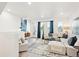 Spacious living room features a sectional sofa, stylish accents, and ample natural light at 5128 W 26Th Ave # 207, Denver, CO 80212