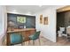 Office with desk, seating, and bath, featuring modern décor and ample lighting at 5128 W 26Th Ave # 207, Denver, CO 80212