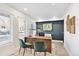Bright home office featuring a large desk, comfortable seating, and natural light at 5128 W 26Th Ave # 207, Denver, CO 80212