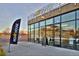 Exterior of Row House fitness studio with large glass windows and a promotional banner, showcasing a modern design at 5128 W 26Th Ave # 207, Denver, CO 80212