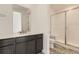 Modern bathroom features double vanity, tiled floors and a glass shower enclosure at 39876 Floyd St, Elizabeth, CO 80107