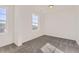 Bright bedroom features neutral carpet and multiple windows for natural light at 39876 Floyd St, Elizabeth, CO 80107